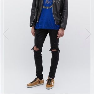 AMIRI - THRASHER' RIPPED SLIM FIT JEANS